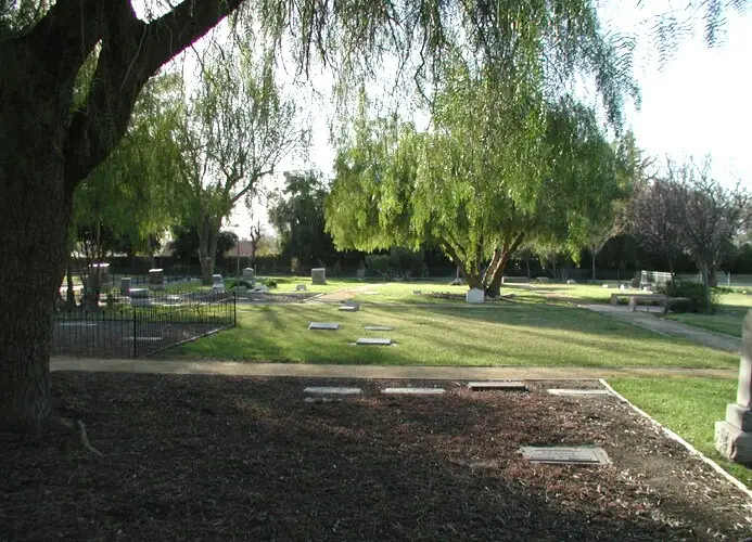 A serene landscape view of Simi Valley Public Cemetery , featuring well-maintained grounds and beautiful trees, captured by Express Monument.