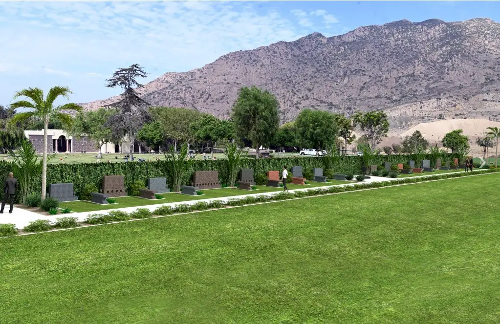 A serene landscape view of El Toro Memorial Park featuring memorial monuments and lush green surroundings.