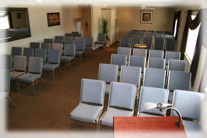 Interior of the chapel at 20 High Desert Funeral Chapel & Cremation in San Bernardino, with chairs lined up for a memorial service.