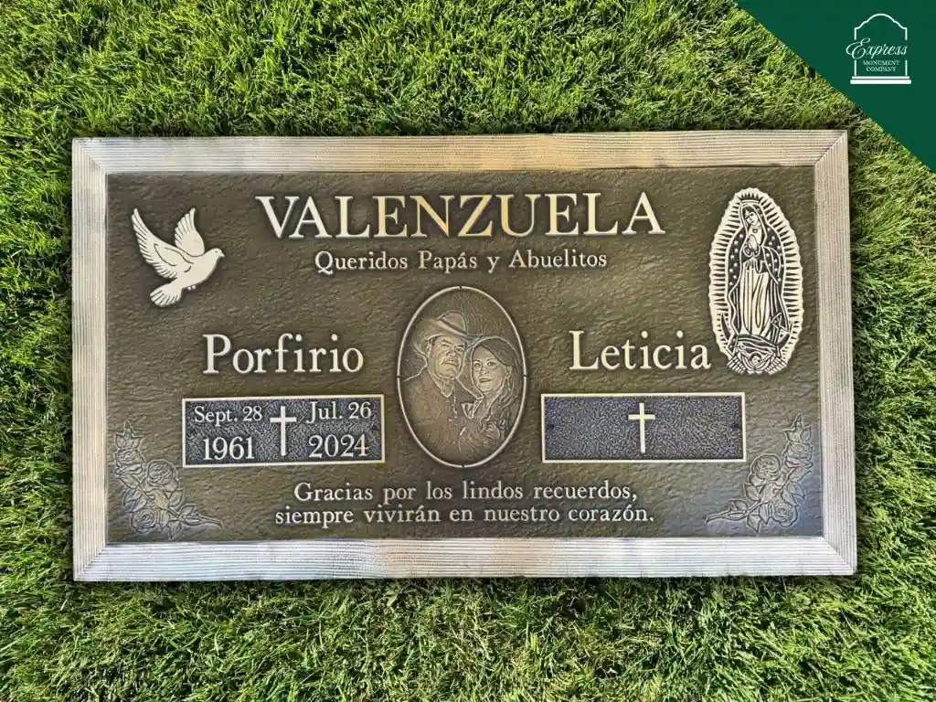bronze flat double headstone set on granite base with gold-leaf lettering